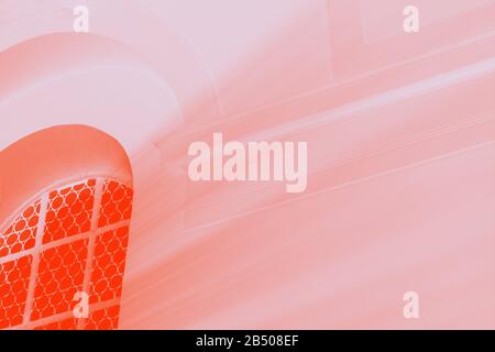 Light rays through the window. Orange lush lava and pale pink colors, toned photo Stock Photo