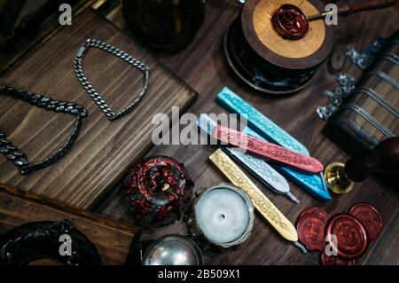 Stamps for sealing wax on an old textured gray table Stock Photo