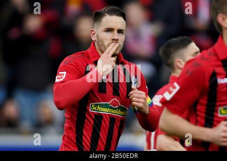 Freiburg, Germany. 07th Mar, 2020. Football: Bundesliga, SC Freiburg - 1st FC Union Berlin, 25th matchday in the Black Forest Stadium. Christian Günter of Freiburg cheers the 2:0. Credit: Patrick Seeger/dpa - IMPORTANT NOTE: In accordance with the regulations of the DFL Deutsche Fußball Liga and the DFB Deutscher Fußball-Bund, it is prohibited to exploit or have exploited in the stadium and/or from the game taken photographs in the form of sequence images and/or video-like photo series./dpa/Alamy Live News Stock Photo