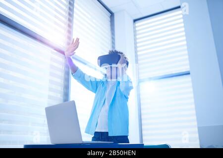 Horizontal shot of unrecognizable African American boy experiencing augmented reality using VR headset, copy space Stock Photo