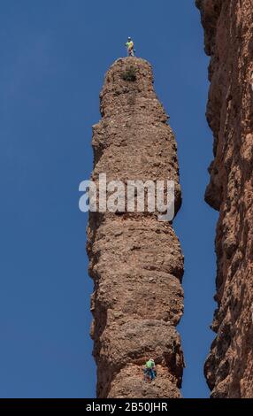 Climbers on a pinnacle in the Mallos de Riglos, Aragon, Spain Stock Photo