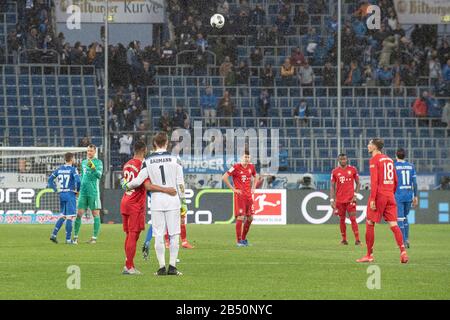 after the repeated posters, posters, banners, versus Hoffenheims Maezen (M? zen) Dietmar Hopp were shown in the fan block of the FC Bayern fans in the stands, the players decided a non-aggression pact for the remaining 13 minutes, Serge GNABRY (front left) M) and goalwart Oliver BAUMANN (1899) on friendly terms; Scandal, scandal; Insult; Soccer 1.Bundesliga, 24th matchday, matchday 24, TSG 1899 Hoffenheim (1899) - FC Bayern Munich (M) 0: 6, on 02/29/2020 in Sinsheim / Germany DFL REGULATIONS PROHIBIT ANY USE OF PHOTOGRAPHS AS IMAGE SEQUENCES AND / OR QUASI VIDEO. ? Sven Simon Fotoagentur GmbH Stock Photo