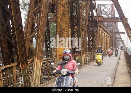 Hanoi Long Bien bridge - Motorists ride accross the historic Long Bien bridge in Hanoi, Vietnam, Southeast Asia. Stock Photo