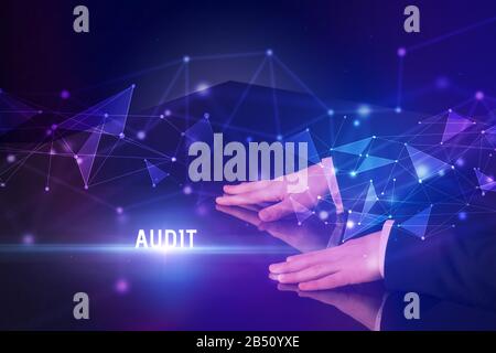Businessman touching huge screen with AUDIT inscription, modern technology business concept Stock Photo