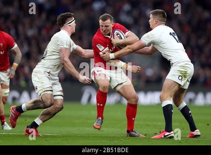 Wales Hadleigh Parkes (centre) is tackled by England's Owen Farrell (right) and Tom Curry (left) during the Guinness Six Nations match at Twickenham Stadium, London. Stock Photo