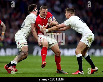 Wales Hadleigh Parkes (centre) is tackled by England's Owen Farrell (right) and Tom Curry (left) during the Guinness Six Nations match at Twickenham Stadium, London. Stock Photo