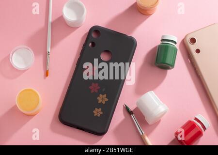 Flower art drawn on black phone case, top view Stock Photo