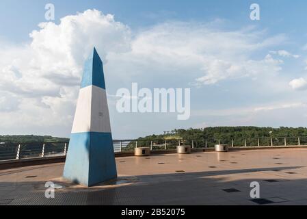 Obelisk painted with the national colors of Argentina in the Triple frontier, international border between Paraguay, Brazil and Argentina Stock Photo
