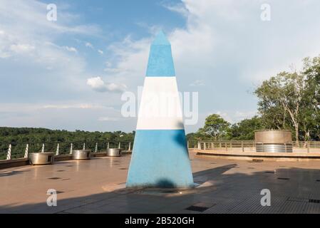 Obelisk painted with the national colors of Argentina in the Triple frontier, international border between Paraguay, Brazil and Argentina Stock Photo