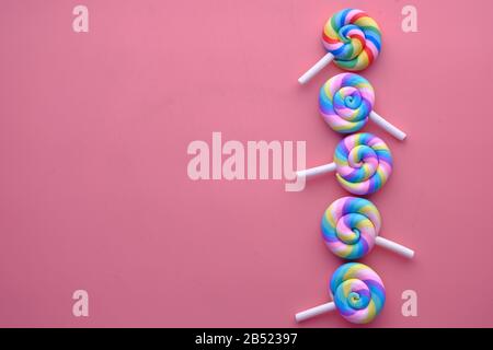 multi color lolly pop on pink background  Stock Photo