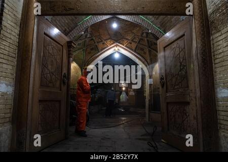 Iranian health ministry staff, the provincial fire department and municipal staffs are disinfecting public places to prevent Coronavirus(COVID19) at late night using machinery and mobile pumps at Historical urban context and alleys of Shiraz city, Fars province, Iran. Schools, Sport cpmplex, Concerts and all social gatherings have been canceled in Iran.