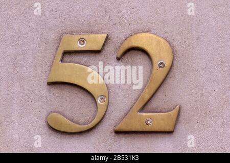 House number 52 bold and large on a wall Stock Photo