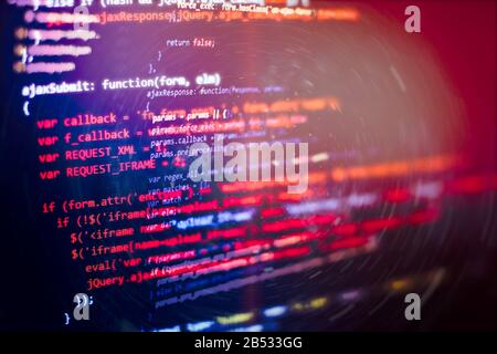 Code language on a computer screen with a shallow depth of field. Stock Photo