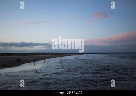 ST ANDREWS, SCOTLAND - 2/3/2020 - A view of west sands at dusk Stock Photo