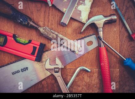A Collection Of Grungy Workshop Tools On A Wooden Bench Stock Photo