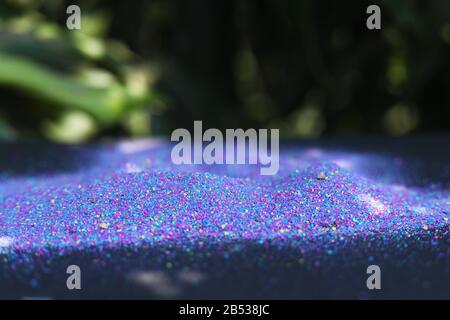 Multi-colored powder on nature background Stock Photo