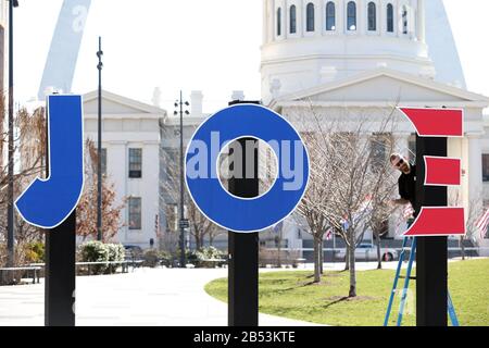 St. Louis, United States. 07th Mar, 2020. A worker secures letters to poles before a Joe Biden campaign rally near the Gateway Arch, in St. Louis on Saturday, March 7, 2020. Photo by Bill Greenblatt/UPI Credit: UPI/Alamy Live News Stock Photo