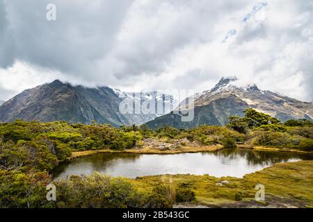 Key Summit with the lakes and Fjordland mountain range at the back, New Zealand Stock Photo