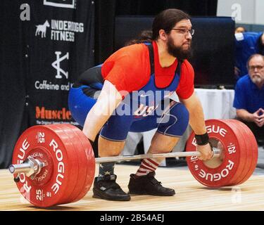 Columbus, Ohio, USA. 7th Mar, 2020. Caine Wilkes (USA) lifts 180 kgs. in the snatch in the IWF Rogue World Challenge in the Arnold Sports Festival in Columbus, Ohio, USA. Columbus, Ohio, USA. Credit: Brent Clark/Alamy Live News Stock Photo