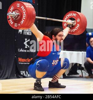 Columbus, Ohio, USA. 7th Mar, 2020. Caine Wilkes (USA) lifts 180 kgs. in the snatch in the IWF Rogue World Challenge in the Arnold Sports Festival in Columbus, Ohio, USA. Columbus, Ohio, USA. Credit: Brent Clark/Alamy Live News Stock Photo