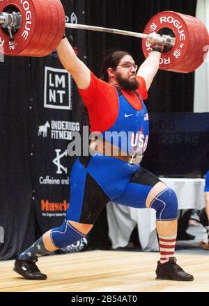 Columbus, Ohio, USA. 7th Mar, 2020. Caine Wilkes (USA) lifts 225 kgs. in the clean and jerk in the IWF Rogue World Challenge in the Arnold Sports Festival in Columbus, Ohio, USA. Columbus, Ohio, USA. Credit: Brent Clark/Alamy Live News Stock Photo