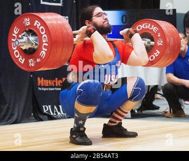 Columbus, Ohio, USA. 7th Mar, 2020. Caine Wilkes (USA) lifts 225 kgs. in the clean and jerk in the IWF Rogue World Challenge in the Arnold Sports Festival in Columbus, Ohio, USA. Columbus, Ohio, USA. Credit: Brent Clark/Alamy Live News Stock Photo