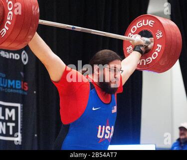 Columbus, Ohio, USA. 7th Mar, 2020. Caine Wilkes (USA) lifts 180 kgs. in the snatch in the IWF Rogue World Challenge in the Arnold Sports Festival in Columbus, Ohio, USA. Columbus, Ohio, USA. Credit: Brent Clark/Alamy Live News Stock Photo