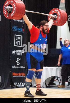 Columbus, Ohio, USA. 7th Mar, 2020. Caine Wilkes (USA) lifts 225 kgs. in the clean and jerk in the IWF Rogue World Challenge in the Arnold Sports Festival in Columbus, Ohio, USA. Columbus, Ohio, USA. Credit: Brent Clark/Alamy Live News Stock Photo