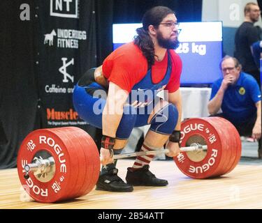 Columbus, Ohio, USA. 7th Mar, 2020. Caine Wilkes (USA) lifts 225 kgs. in the clean and jerk in the IWF Rogue World Challenge in the Arnold Sports Festival in Columbus, Ohio, USA. Columbus, Ohio, USA. Credit: Brent Clark/Alamy Live News Stock Photo