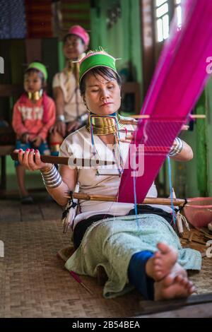 Portrait of the Long neck girl and woman in their house, Inle lake, Myanmar, Asia. Stock Photo