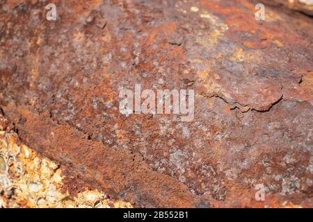 Rusty metal background with streaks of rust. The metal surface rusted spots. Stock Photo