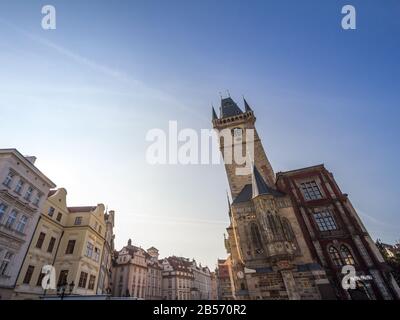 Panorama of Old Town Square (Staromestske Namesti) with a focus on the clock tower of Old Town Hall, a major landmark of Prague, Czech Republic, also Stock Photo