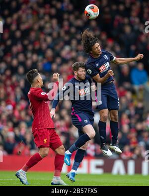 Liverpool. 8th Mar, 2020. AFC Bournemouth's Nathan Ake (R) competes during the English Premier League match between Liverpool and AFC Bournemouth at Anfield in Liverpool, Britain on March 7, 2020. Credit: Xinhua/Alamy Live News Stock Photo