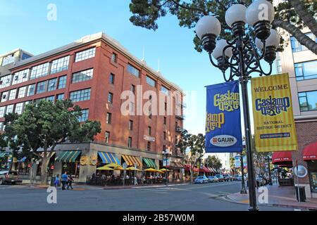 Signs and buildings in the Gaslamp Quarter Historic District. This 16.5-block neighborhood hosts numerous festivals. Stock Photo