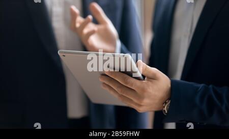 Confident businessman use modern tablet with wireless internet Stock Photo