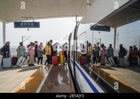 Nanjing, China's Anhui Province. 20th Feb, 2020. Migrant workers from Anhui Province board a special train to Kunshan of east China's Jiangsu Province to resume work in Suzhou City, east China's Anhui Province, Feb. 20, 2020. Credit: Li Bo/Xinhua/Alamy Live News Stock Photo