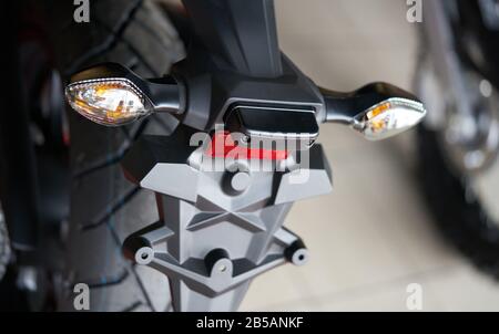 Close up of the rear of a brand new clasic motorcycle, soft focus. Stock Photo