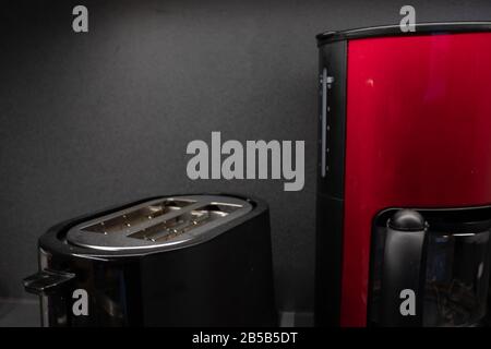 Appliances and devices in the kitchen for cooking. Toaster and coffee maker with copy space Stock Photo
