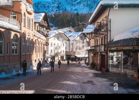 Cortina d Ampezzo, Italy - February 9 2019: Corso Italia Pedestrian Zone and Main Street in the Center of Cortina d Ampezzo, a Famous Skiing Resort in Stock Photo