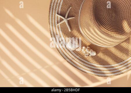 Straw summer hat with seashells and corals onit with sun shades Stock Photo