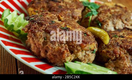 Shami kebab, variety of kebab, originating from the Indian subcontinent,  Awadhi cuisine, Traditional assorted Indian  dishes, Top view. Stock Photo