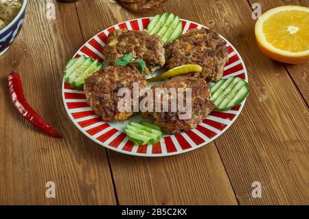 Shami kebab, variety of kebab, originating from the Indian subcontinent,  Awadhi cuisine, Traditional assorted Indian  dishes, Top view. Stock Photo