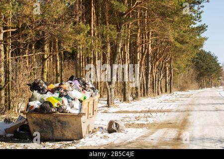 Garbage waste in park full of all sort of trash. Stock Photo