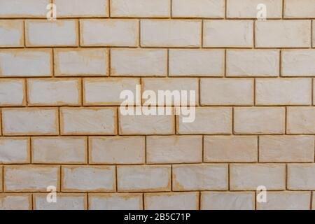 White and yellow dirty bricks background wall Stock Photo