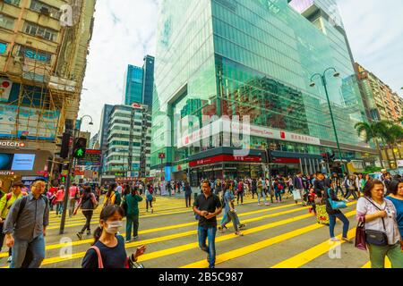 Hong Kong, China - December 5, 2016: Asian people in iSQUARE shopping center located in Nathan Road, Tsim Sha Tsui, Kowloon, shopping district. One of Stock Photo