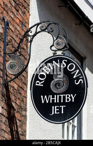 One of the many small Whitby Black Jet shop signs in the historic old quarter of Whitby, a fishing port, in North Yorkshire, Britain   Whitby, a seaside Stock Photo