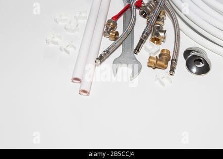plumbing tools and equipment on white with copy space. Stock Photo