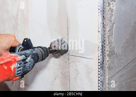 drill hole for electrical outlet outlet, special power tool drill Stock Photo