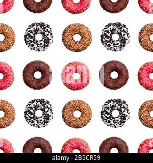 Seamless pattern different colorful donuts on white background isolated top view, donut repeating ornament, bagels wallpaper, sweet cakes texture Stock Photo