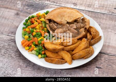 Chicken pie with vegetables and potato fries with gravy Stock Photo